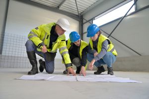 Apprentices in the apprenticeship program learn from an experienced contractor