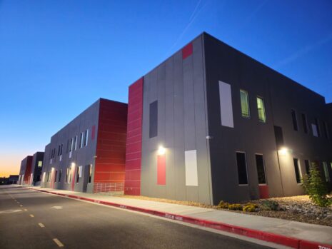 Hanks Middle School - exterior painted concrete panels - gray with black, white, and red accents